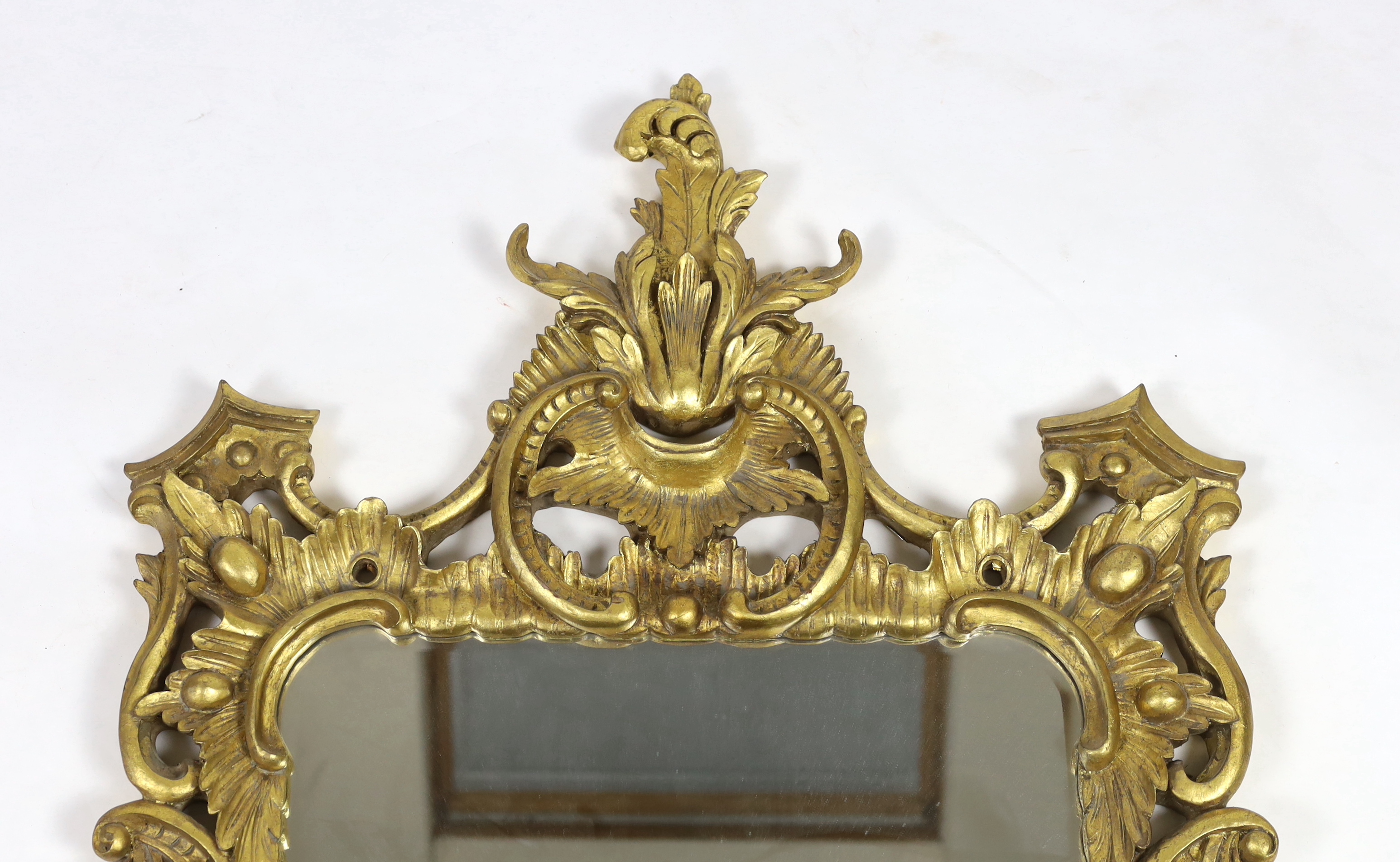 A 19th century Chippendale style carved giltwood wall mirror